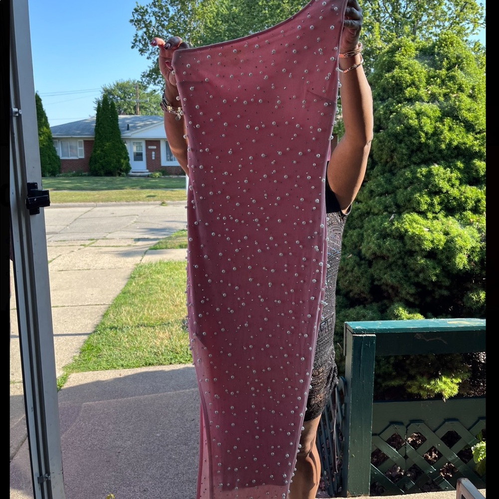 Very cute pink stylish dress with white pearls.